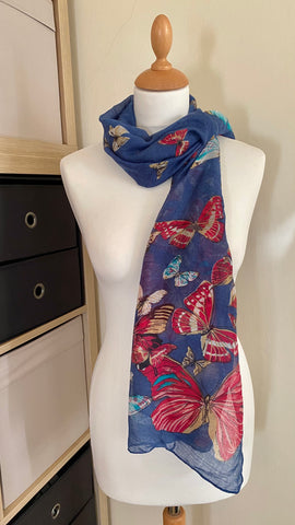 This denim blue butterfly scarf is a unique and versatile accessory for any wardrobe. It’s lightweight and made of 100% polyester which is soft against the skin. It can be worn as a scarf or a wrap and comes in 6 colours: Soft Cream, Dusky Pink, White, Denim Blue, Taupe, and Dove Grey. With an approximate length and width of 180cm x 80cm, this scarf is perfect for almost any occasion.