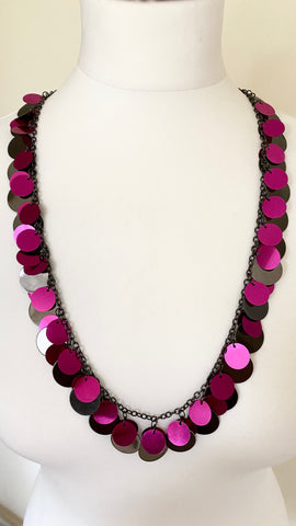 This colourful contemporary necklace with delicate shades of reflective cerise  and silver grey create a mesmerising play of light that will elevate any outfit, closure is a lobster claw fastening with an extension chain. 