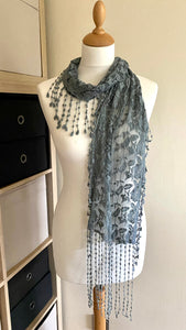 These lightweight and comfortable scarves feature a vintage-style lace effect. Measuring 160cm x 22cm (excluding fringe), they're made from a blend of 50% cotton and 50% polyester for a soft touch and long-lasting wear. Available in a range of colours including cream, sage green and silver grey.