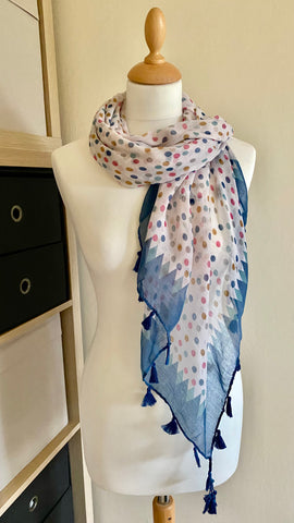 This stylish scarf is made with 100% viscose for an incredibly soft and comfortable feel. With a beautiful mix of pink, blue, brown, and aqua polka dots edged in blue, this scarf is the perfect accessory for any occasion. At 120cm x 120cm, it drapes gracefully for a flattering look.