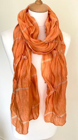 Luxurious silk scarf in burnished orange