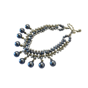 Crafted with elegant faux pearls in a stunning range of silver grey and blue tones, this necklace exudes sophistication and charm. Measuring at 38cm with a 10cm extension chain, lobster claw clasp it can be easily adjusted for the perfect fit. Elevate any outfit with this timeless piece.