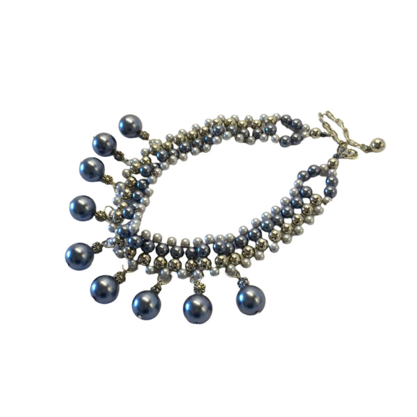 Crafted with elegant faux pearls in a stunning range of silver grey and blue tones, this necklace exudes sophistication and charm. Measuring at 38cm with a 10cm extension chain, lobster claw clasp it can be easily adjusted for the perfect fit. Elevate any outfit with this timeless piece.